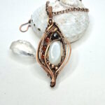 White Moonstone Pendant with Garnets and Hematite
